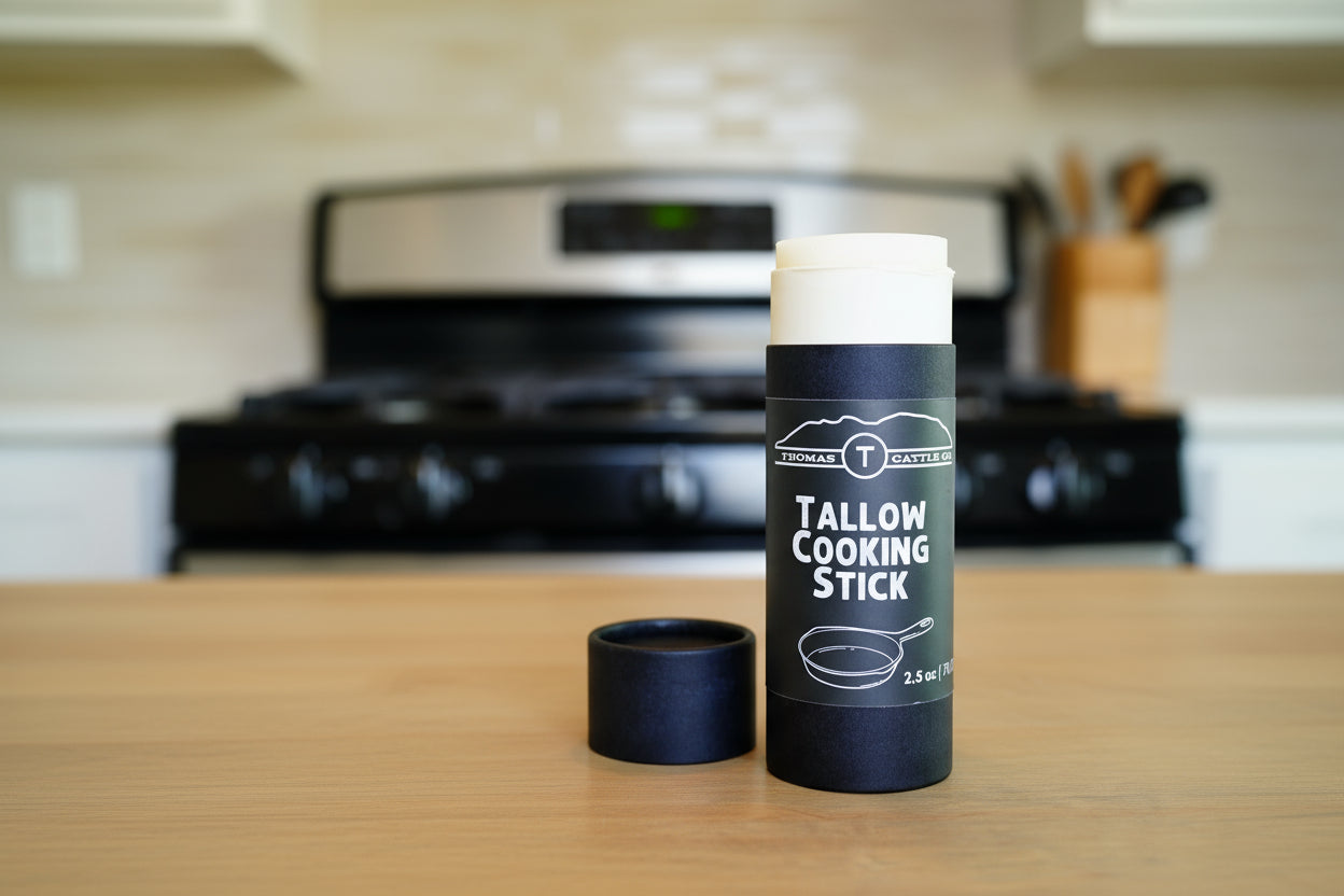 Tallow cooking stick packaging on a wooden surface with a blurred background