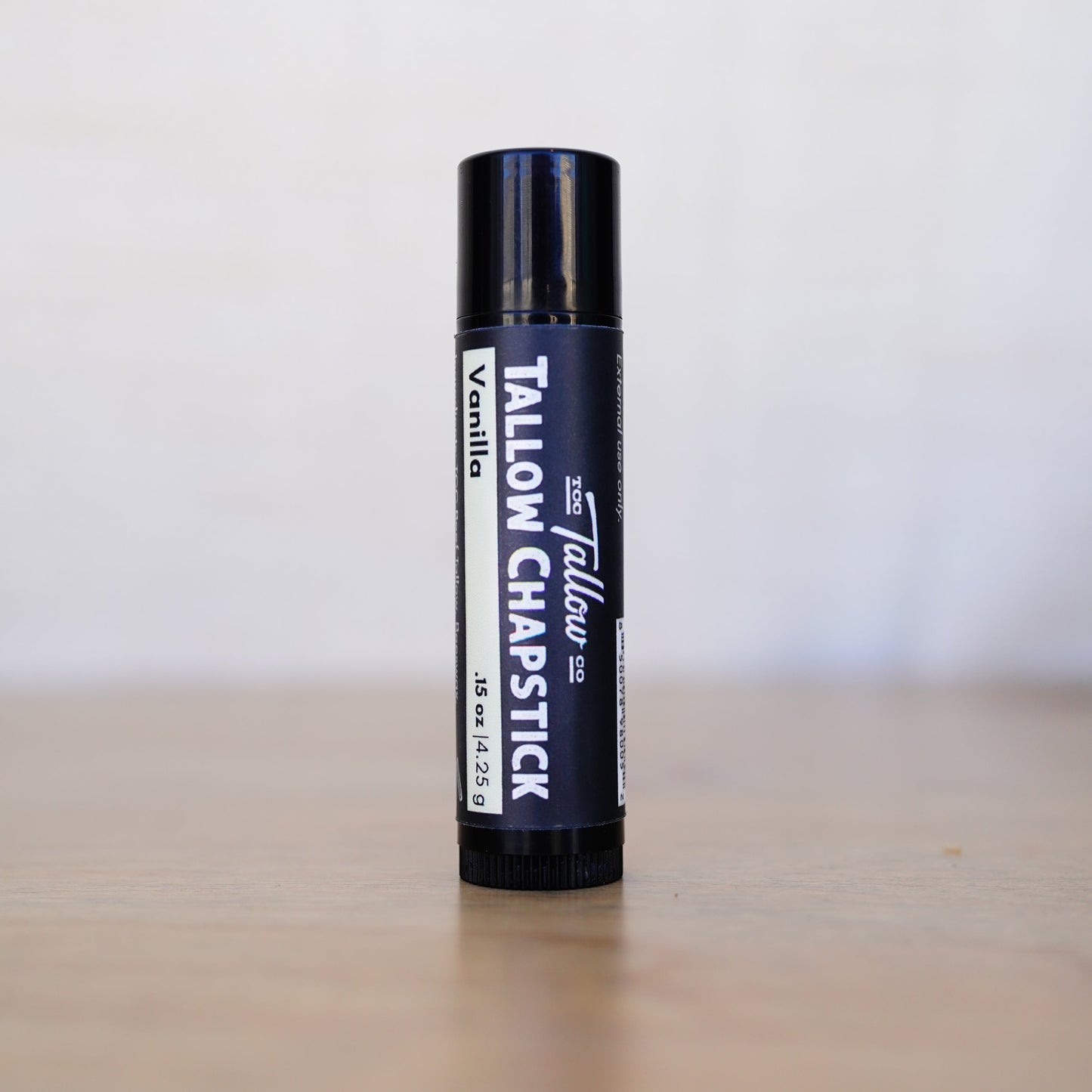 Tallow chapstick on a neutral background