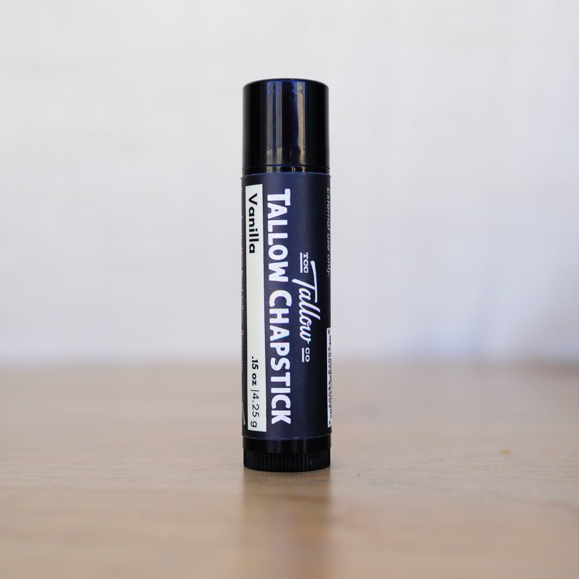 Tallow chapstick on a neutral background