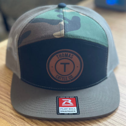 TCC Round Leather Patch Camo Seven Panel Snap Back Hat
