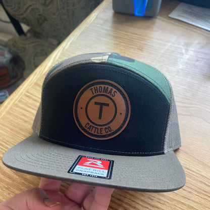 TCC Round Leather Patch Camo Seven Panel Snap Back Hat